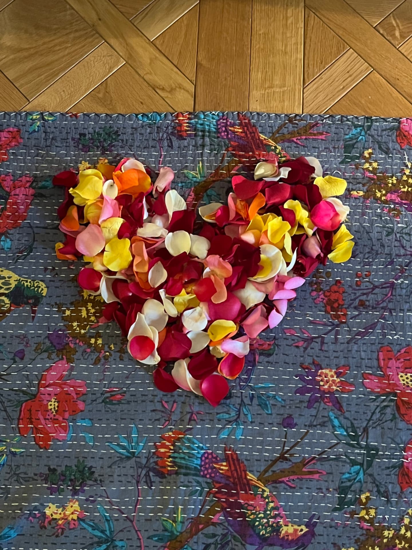 A heart made of colourful rose petals